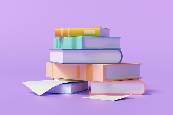 Stack of books on a purple background Stack of books on a purple background