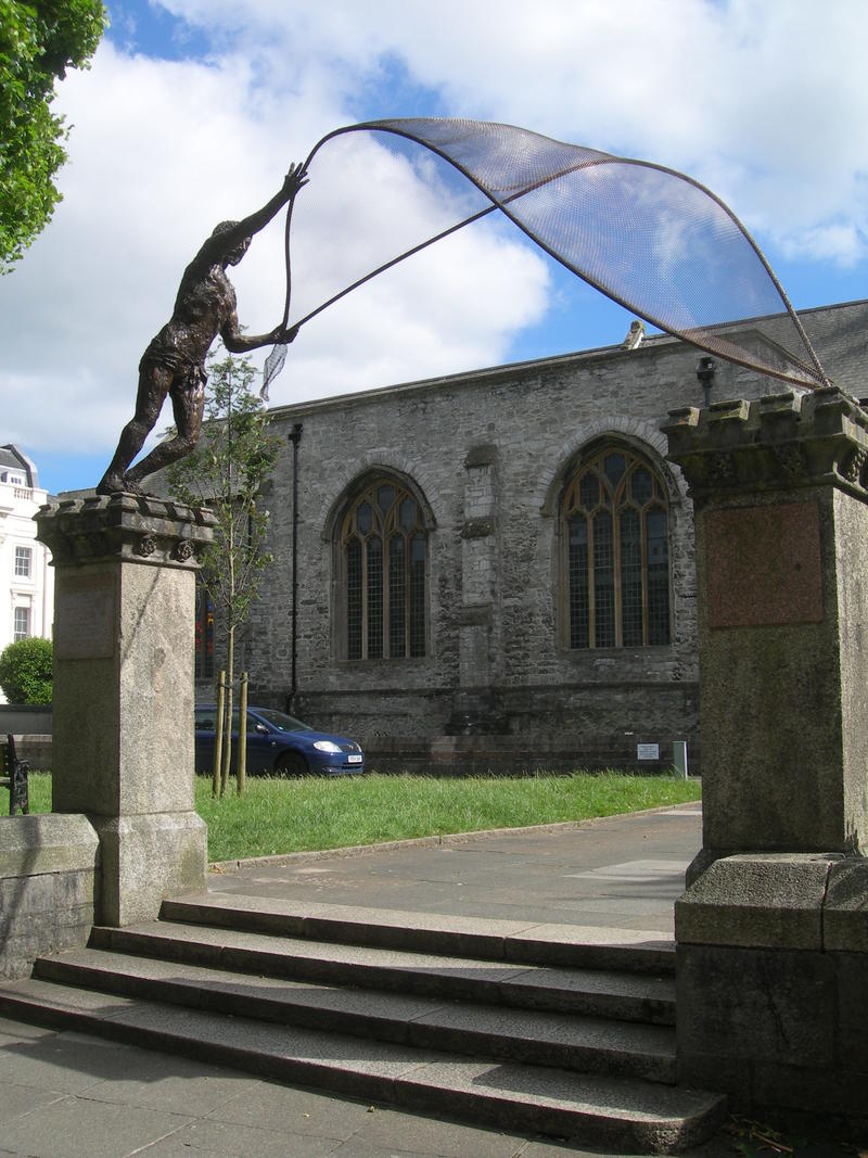 Andrew the fisherman - Credit: Rodney Munday A sculpture of St. Andrew casting his net across two 3m. high pillars in front of the Minster Church in Plymouth.