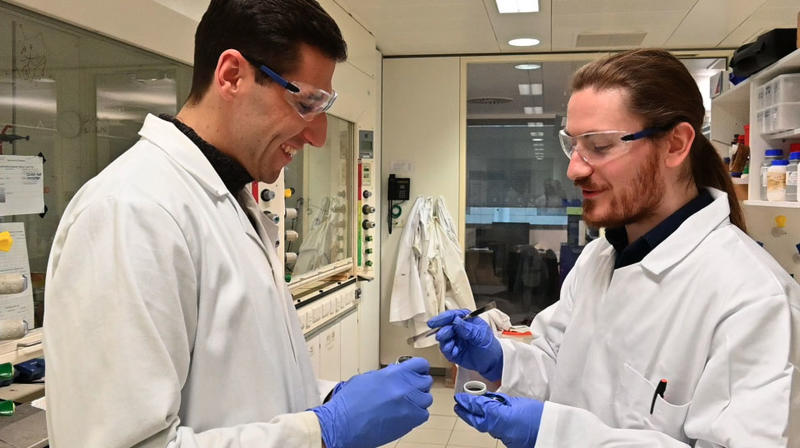 Dr Thomas Schlatzer and Dr Christopher Goult inspect the degraded Teflon sealing rings that started the team’s investigations into this new method for recycling PFAS chemicals (3). Credit_ Department of Chemistry, University of Oxford Dr Thomas Schlatzer and Dr Christopher Goult inspect the degraded Teflon sealing rings that started the team’s investigations into this new method for recycling PFAS chemicals (3). Credit_ Department of Chemistry, University of Oxford