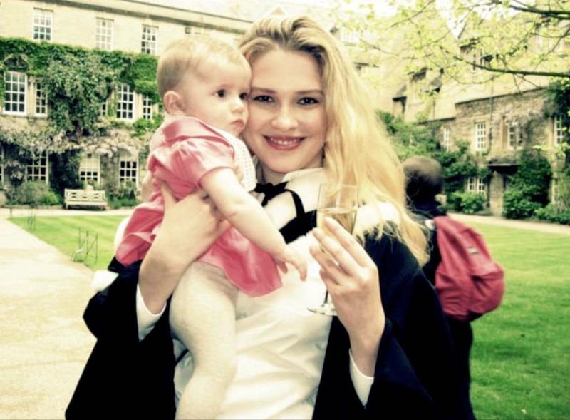 Irra Ariella Khi graduation - credit Irra Ariella Khi Irra Ariella Khi after her graduation ceremony, stood in a college quad, holding a baby