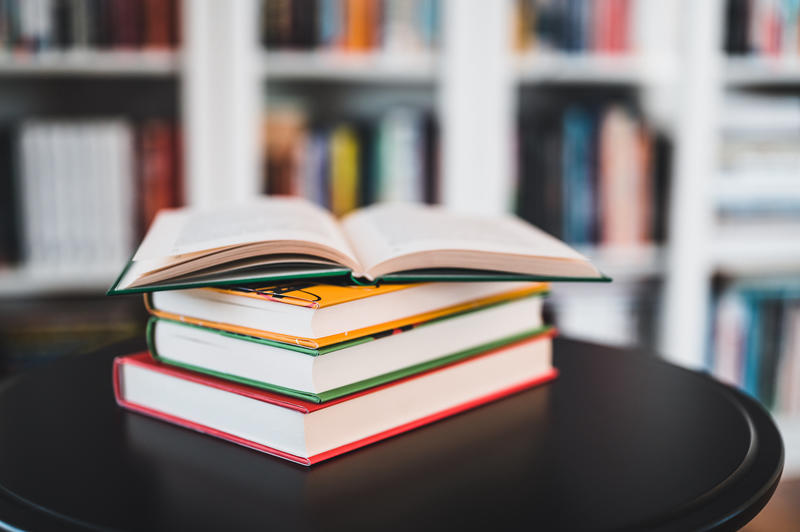 Image of a small pile of brightly coloured books Image of a small pile of brightly coloured books