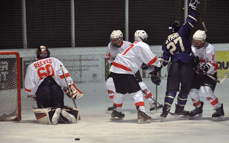 Varsity ice hockey Christopher Byrne - Credit: University of Oxford/Richard Lofthouse An ice hockey match in progress, and Byrne, number 27, is surrounded by opposing players